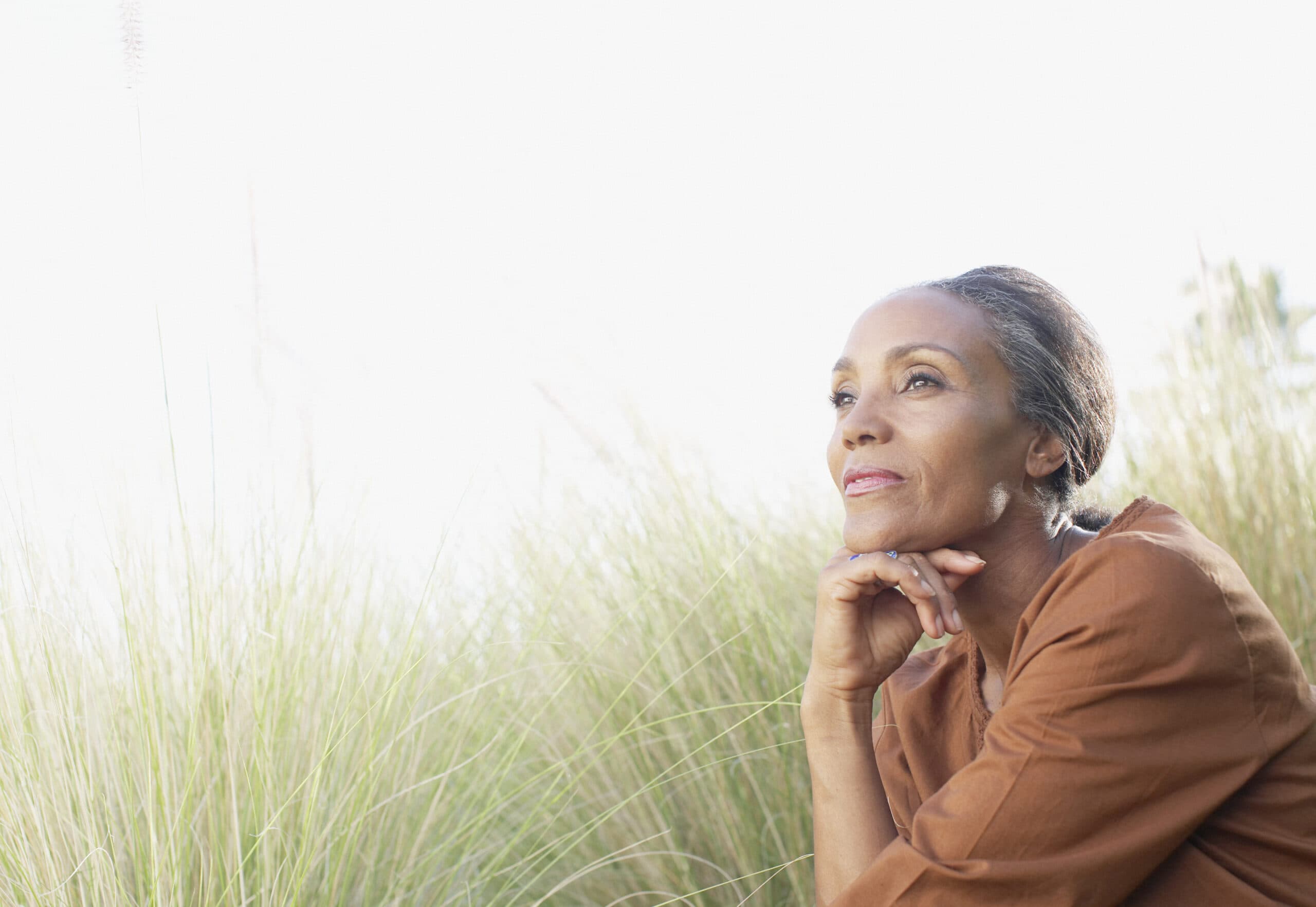 A person looking calm and hopeful outdoors