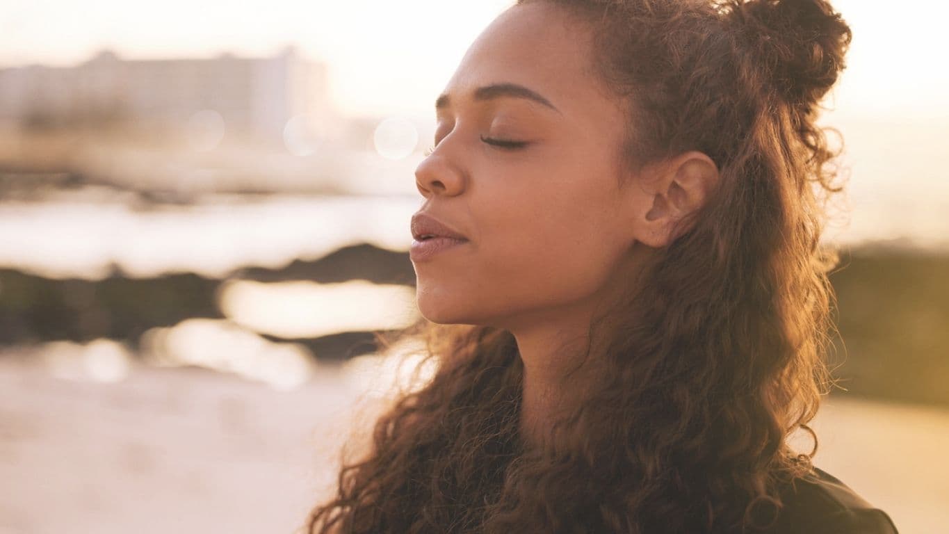 A person enjoying a calm, hopeful moment